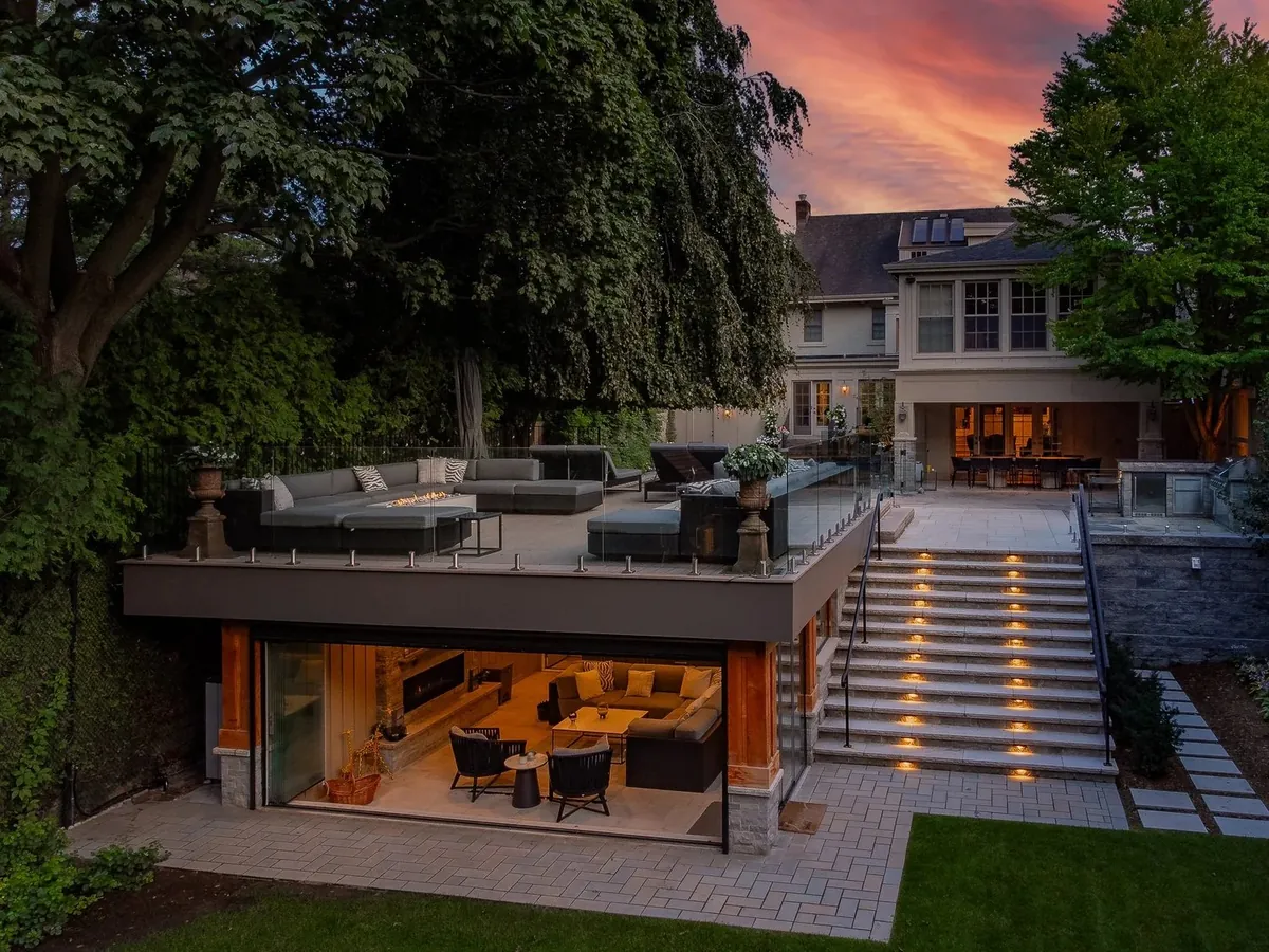 On-site twilight photo of a lit backyard pavilion